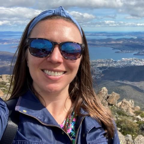 UNE professor Patricia Thibodeau poses with Hobart, Tasmania in the background